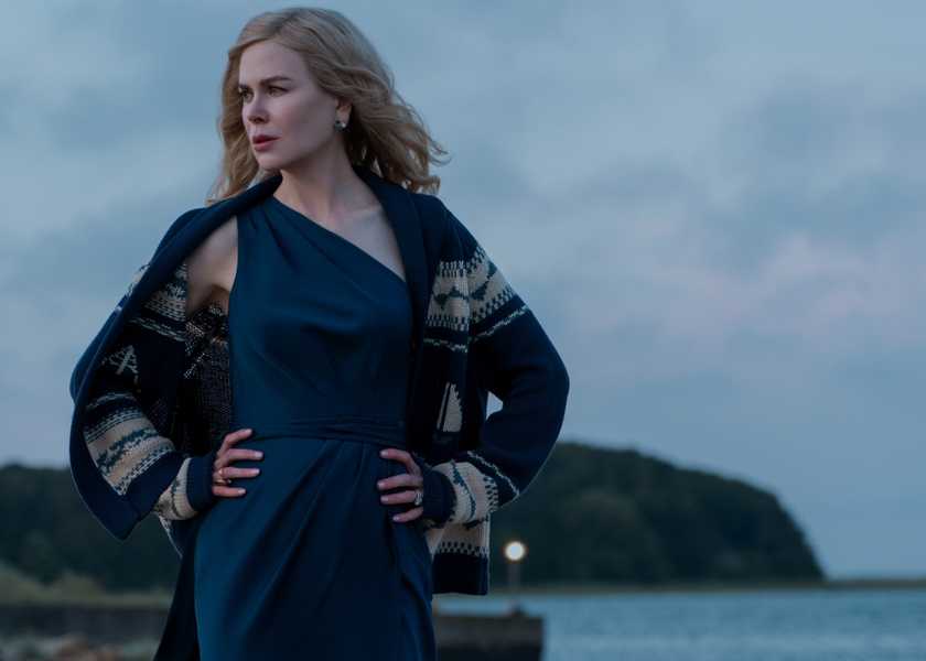 Greer Winbury (Nicole Kidman) with her hands on her hips by the Nantucket shore in The Perfect Couple